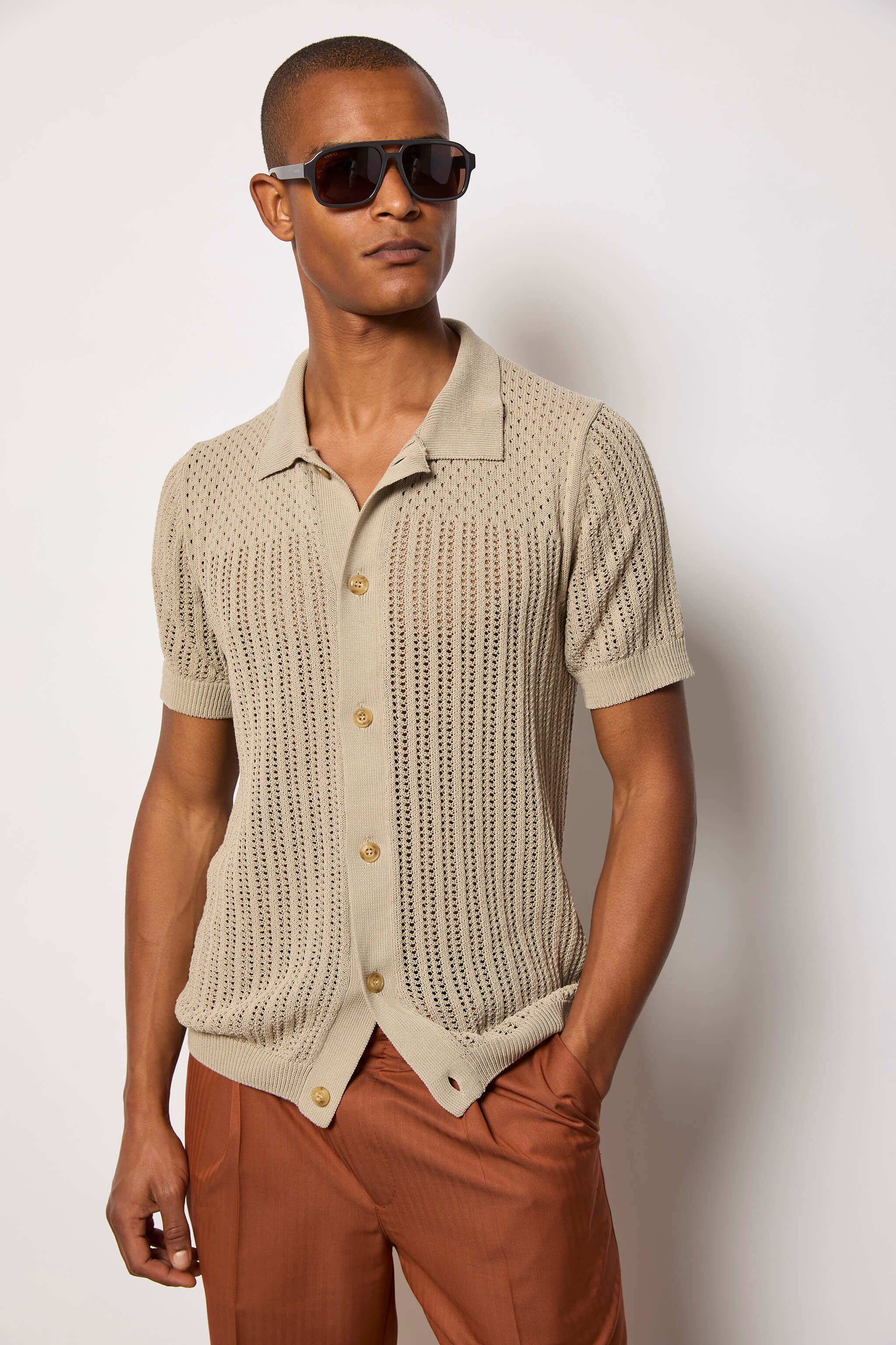 Polo traforata in cotone beige